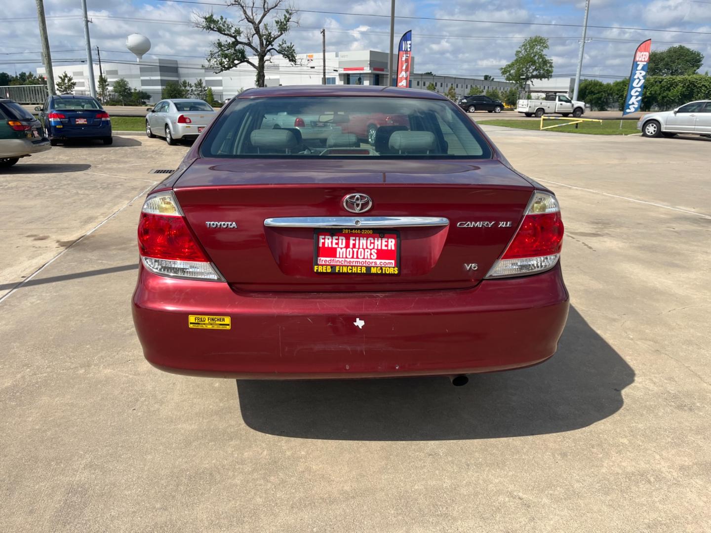 2006 red /TAN Toyota Camry LE V6 (4T1BF30KX6U) with an 3.0L V6 DOHC 24V engine, 5-Speed Automatic Overdrive transmission, located at 14700 Tomball Parkway 249, Houston, TX, 77086, (281) 444-2200, 29.928619, -95.504074 - Photo#5